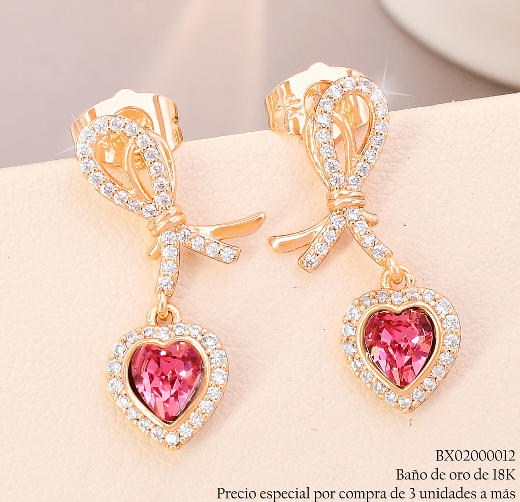 ARETES BAÑO DE ORO 18K XUPING LAZO ZIRC.C/CORAZON🩷 (X)