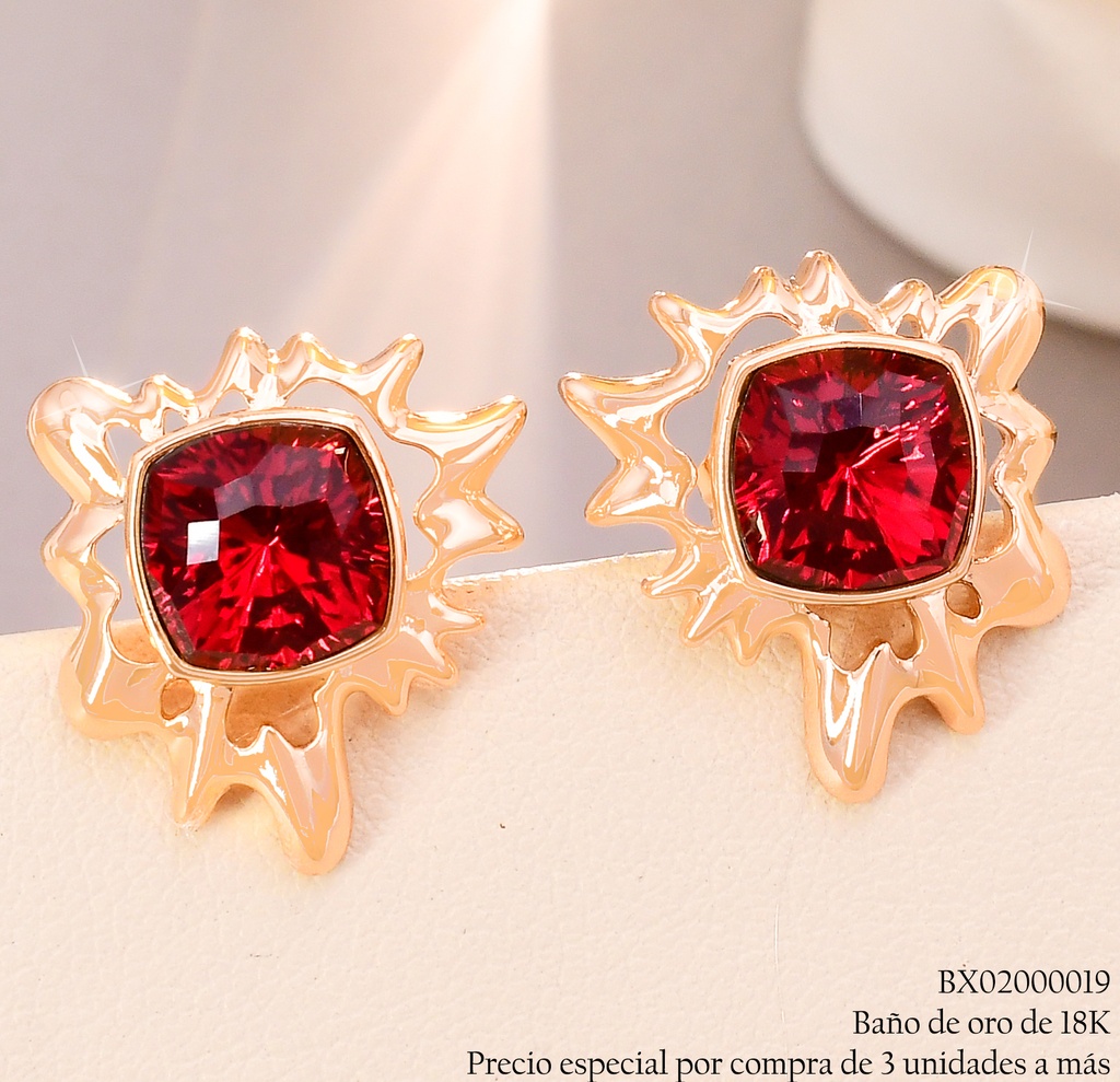 ARETES BAÑO DE ORO 18K. XUPING SOL IRREG.ZIRC.ROJA CENTRO JESM-3772(X)