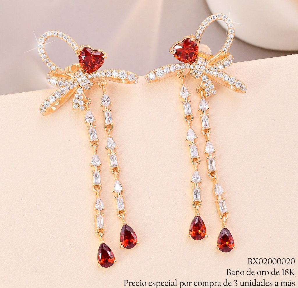 ARETES BAÑO DE ORO 18K. XUPING LAZO/ZIRC.ROJA C/COLGANTE (X)