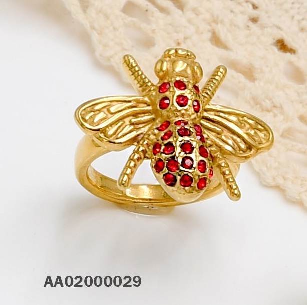 ANILLO ACERO DORADO DE MOSCA CON CIRCONIA ROJA
